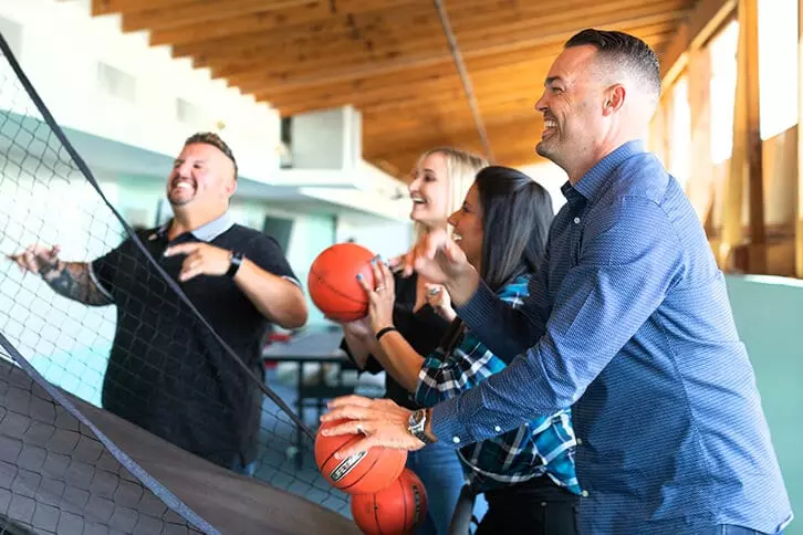 Office workers playing a sport.