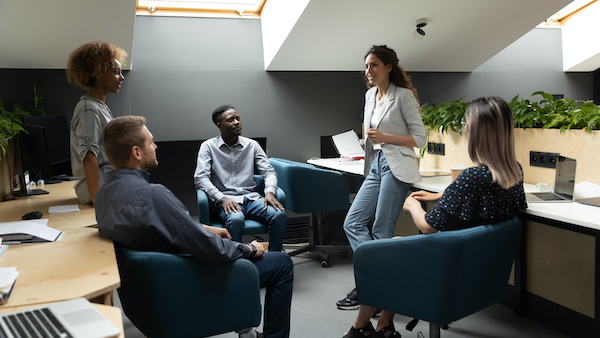 Female,Leader,Talking,To,Diverse,Colleagues,Gather,At,Corporate,Group